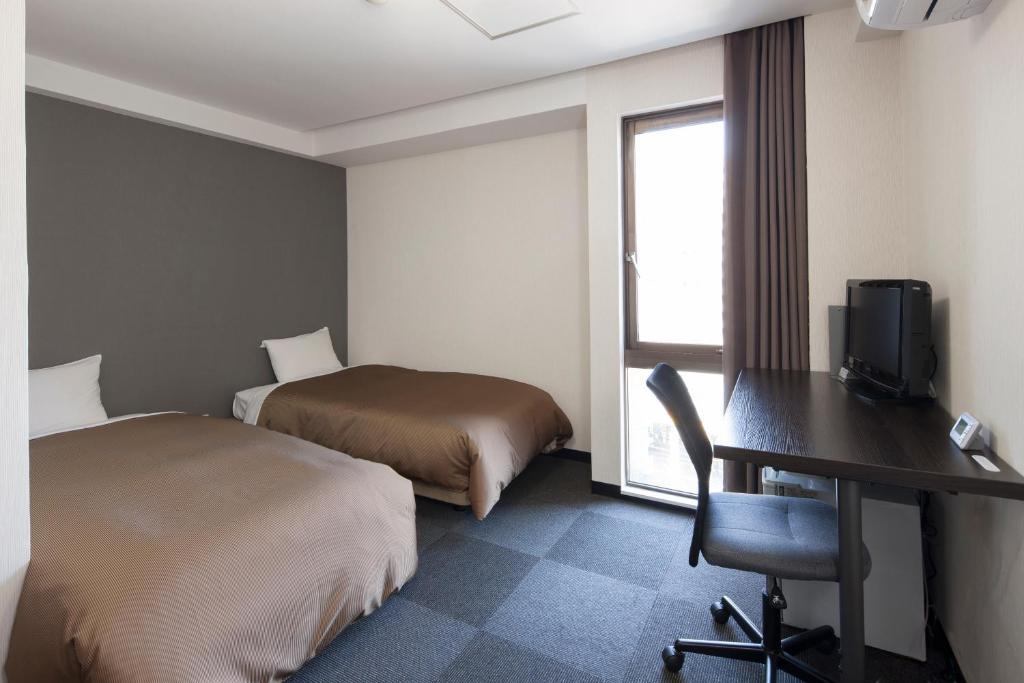 Hotel Plaza Inn Токусіма Номер фото