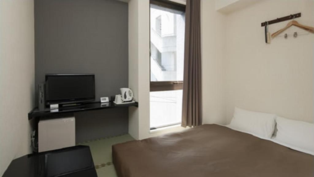 Hotel Plaza Inn Токусіма Номер фото